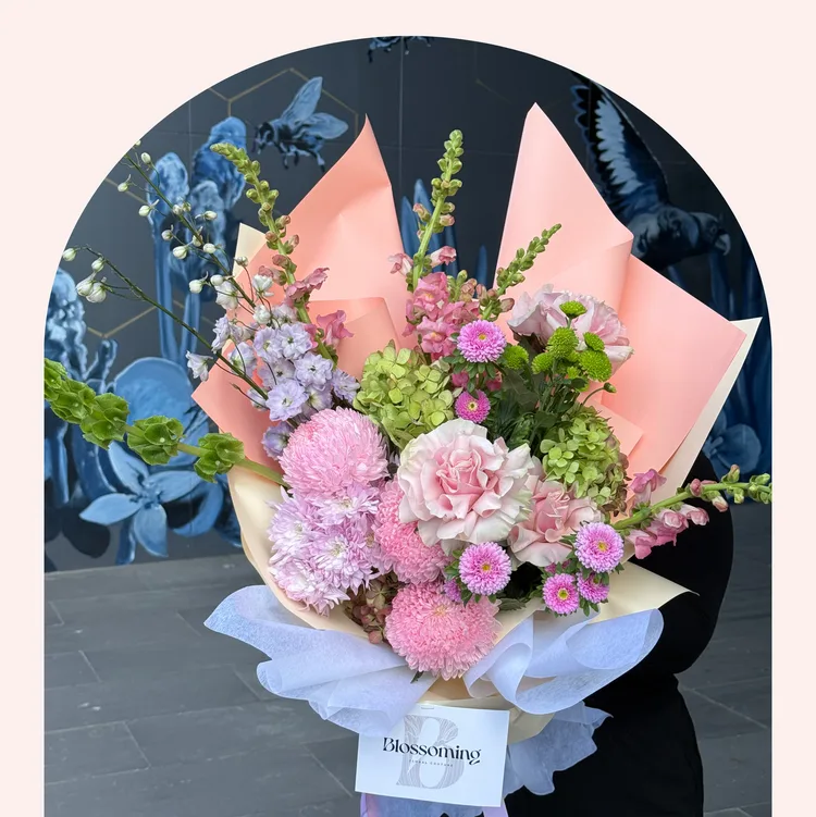 Pastel pink and lilac bouquet in peach paper — Happy Birthday