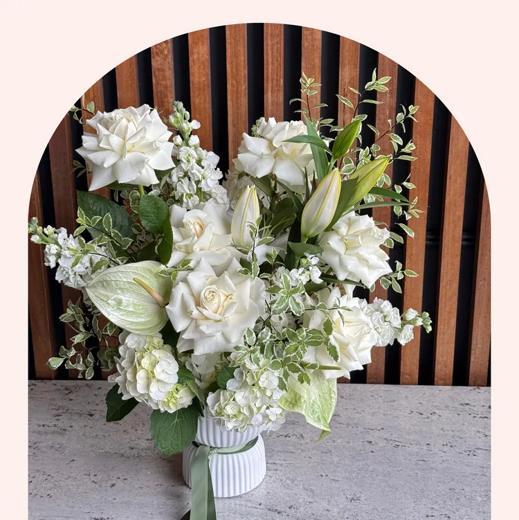 White rose, lily, anthurium and hydrangea in a fluted vase — Sympathy