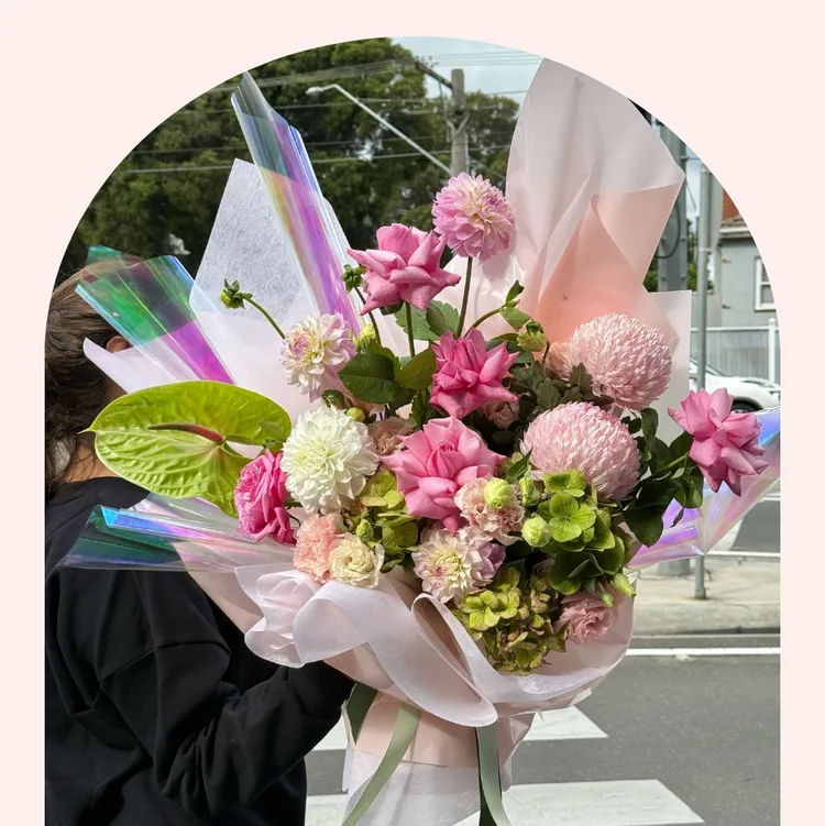 Pink and green dahlia and rose bouquet in iridescent wrap — Welcome Baby